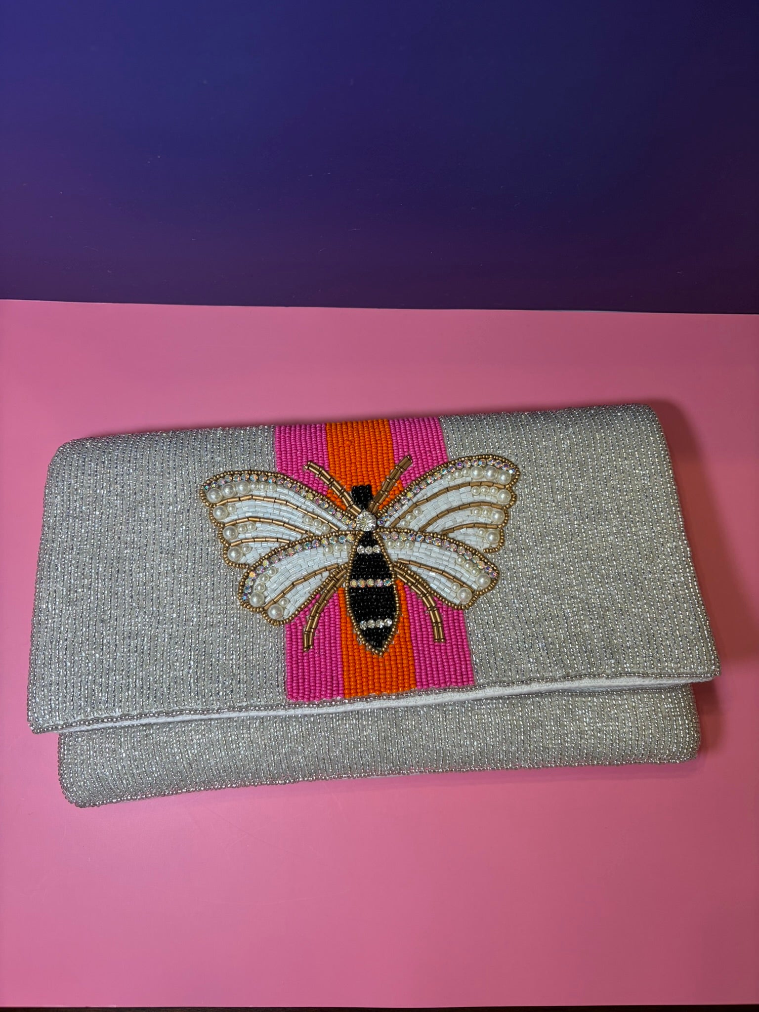 Silver beaded clutch with bee and orange and pink accent