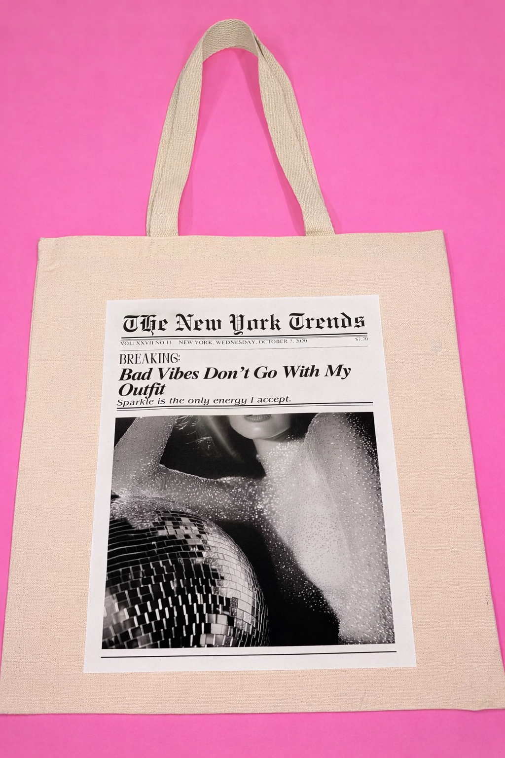 Beige tote bag with a printed design and caption "Bad Vibes Don't Go with My Outfit"