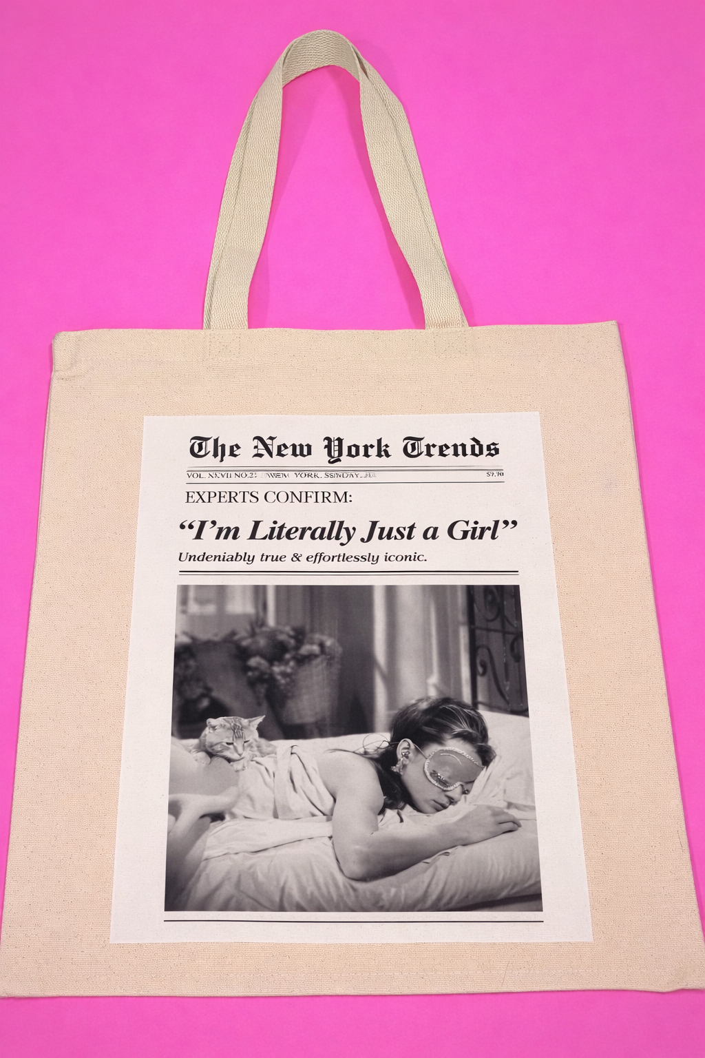 Tote bag with a printed design featuring a woman and a newspaper article "I'm Literally Just a Girl"