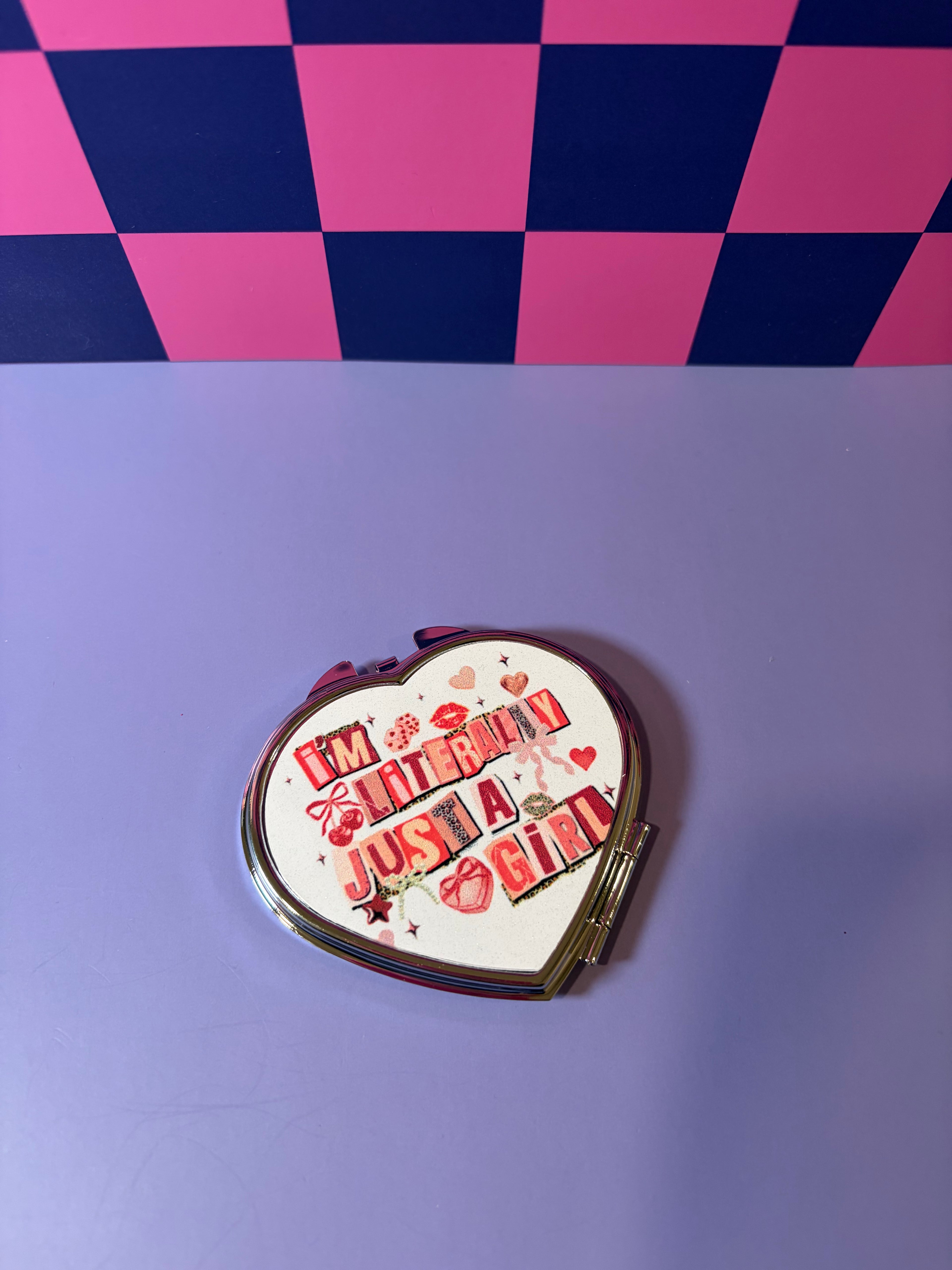 Compact mirror with "I'm Literally Just a Girl" graphic