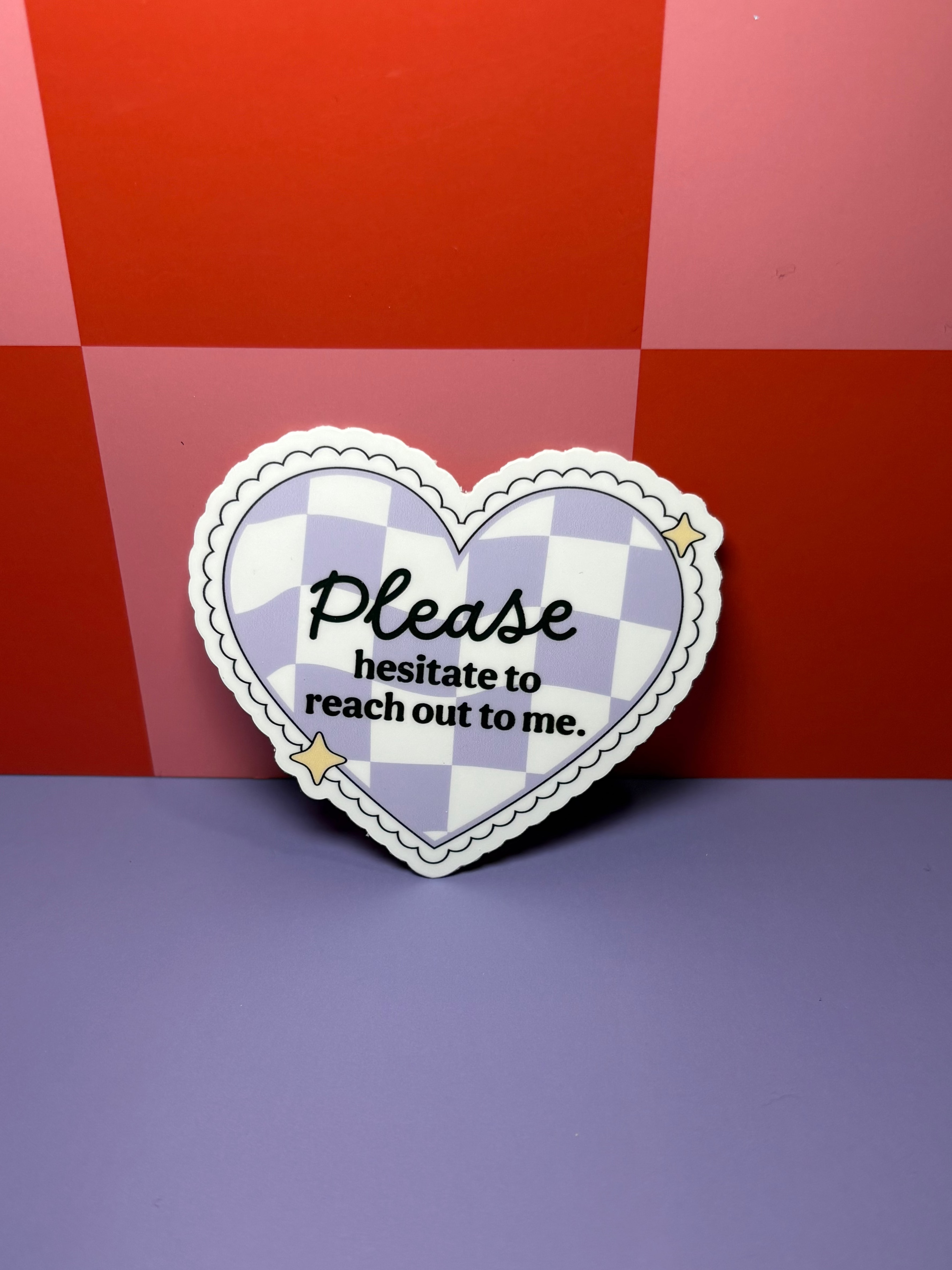 Heart-shaped checkered sticker with "Please Hesitate to Reach Out to Me" text