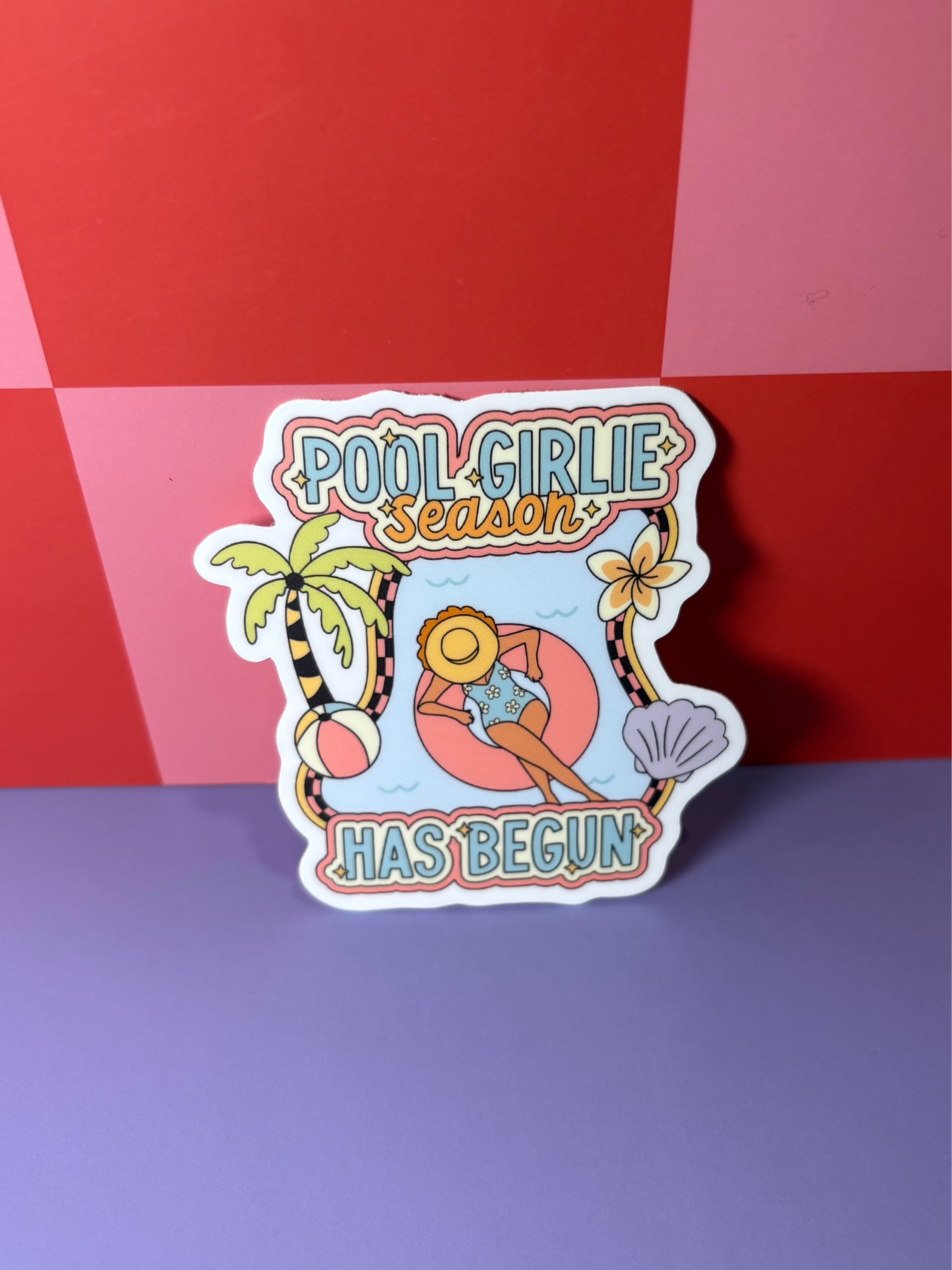 Sticker with 'Pool Girlie Season Has Begun' text and tropical pool design