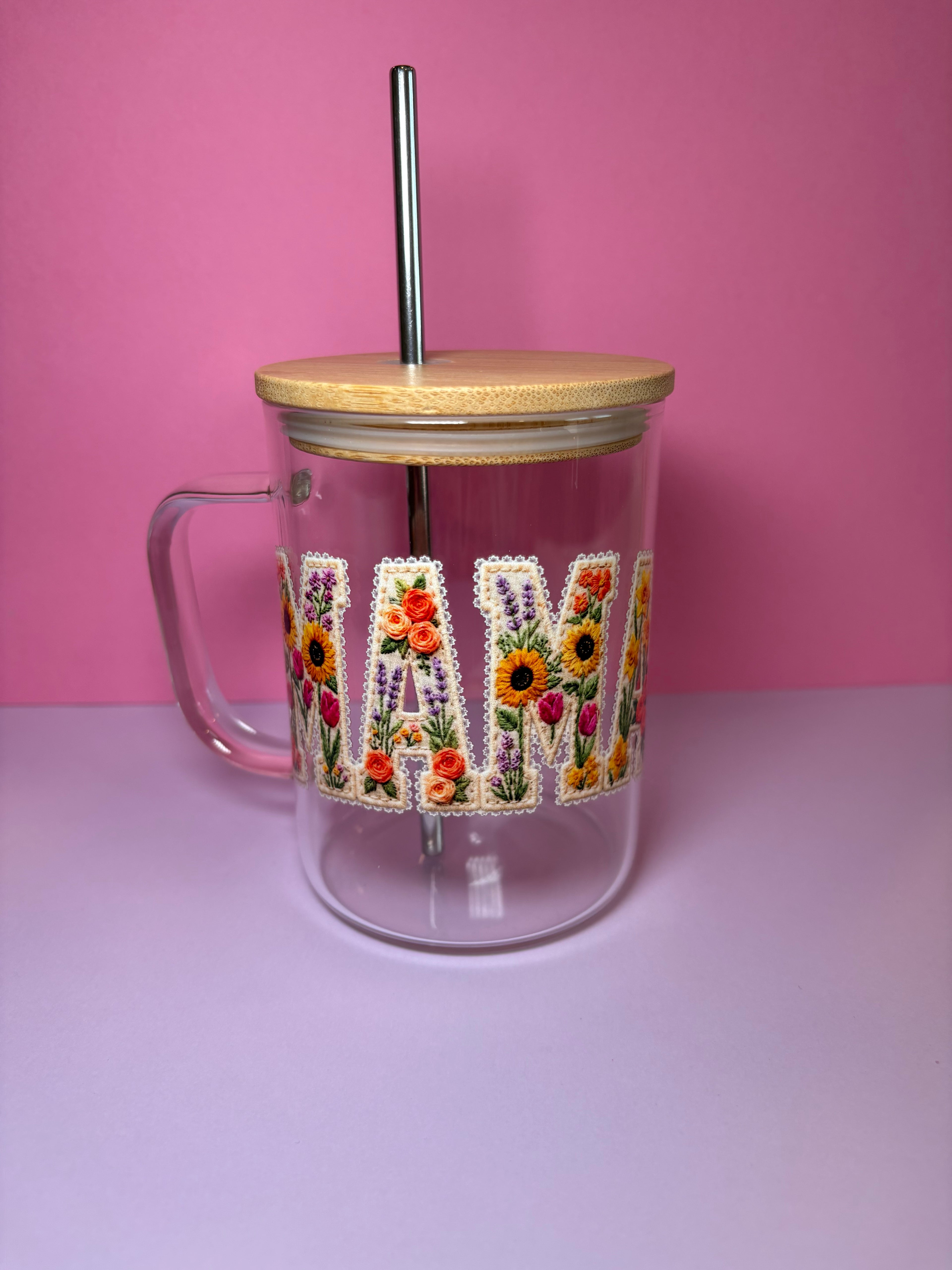 Clear glass tumbler with wooden lid and floral design of "Mama" text