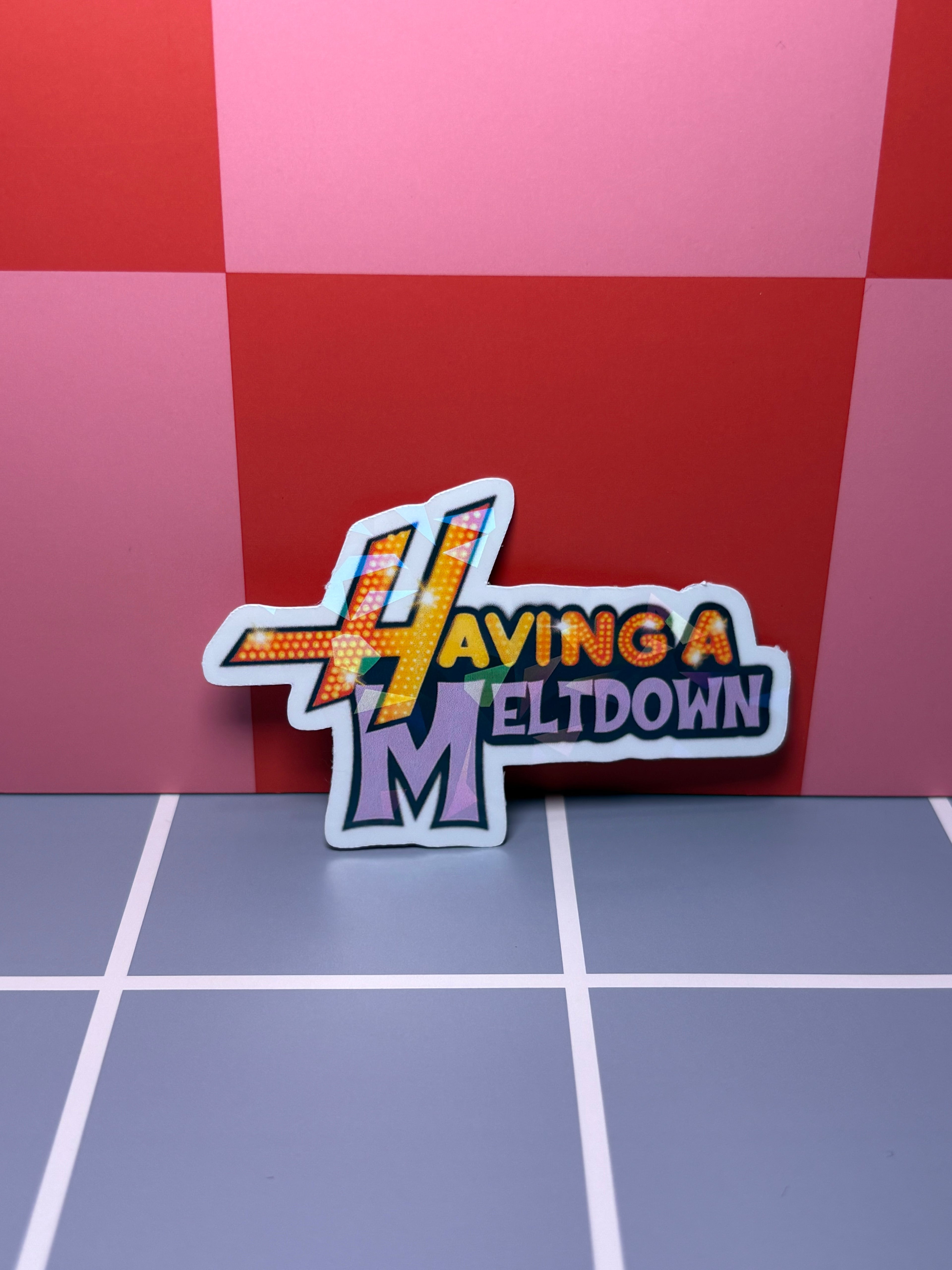 Orange and purple sticker with "Having a Meltdown" text