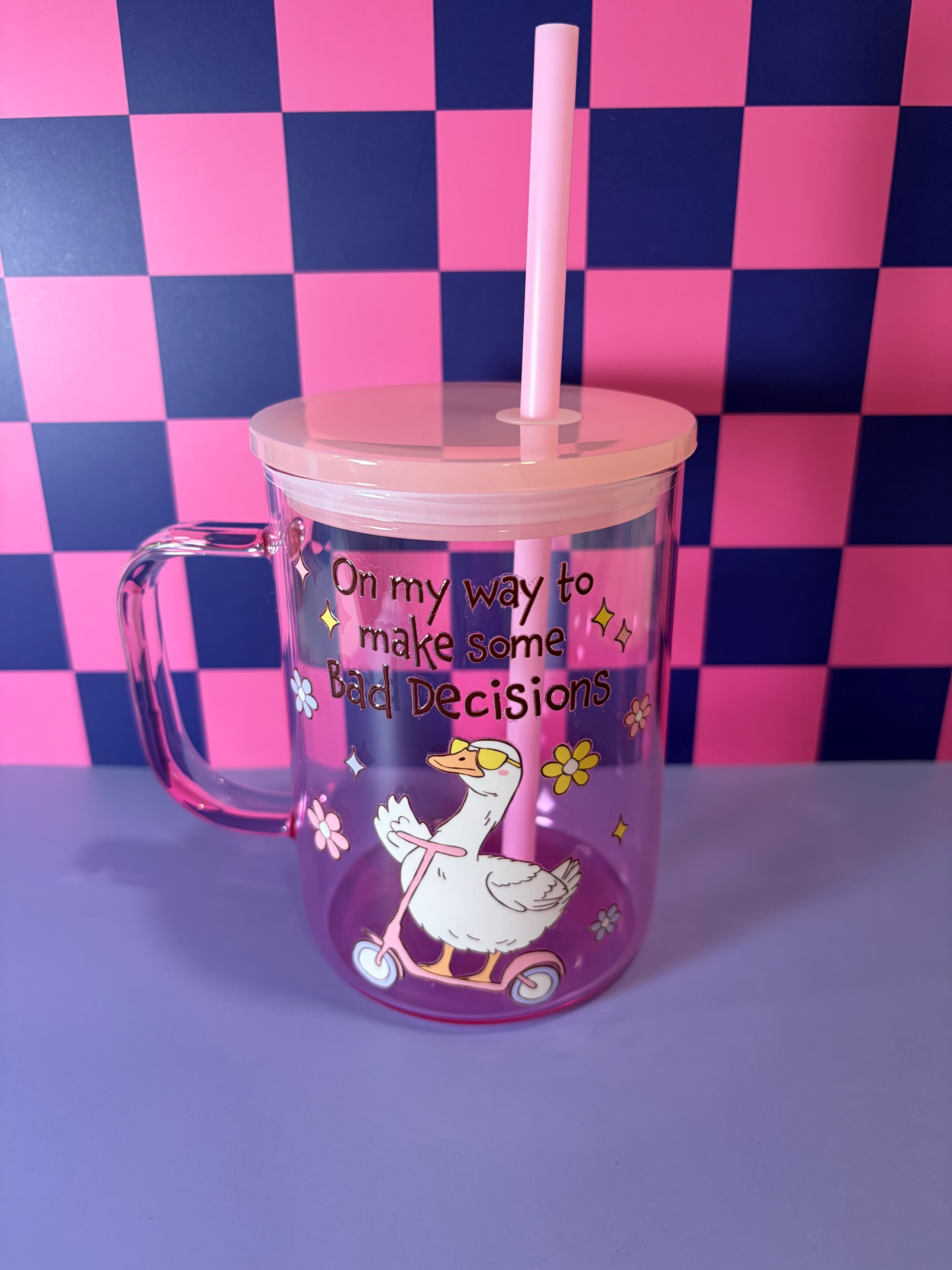 Pink mug with cartoon goose in sunglasses on scooter with "On My Way to Make Some Bad Decisions" design