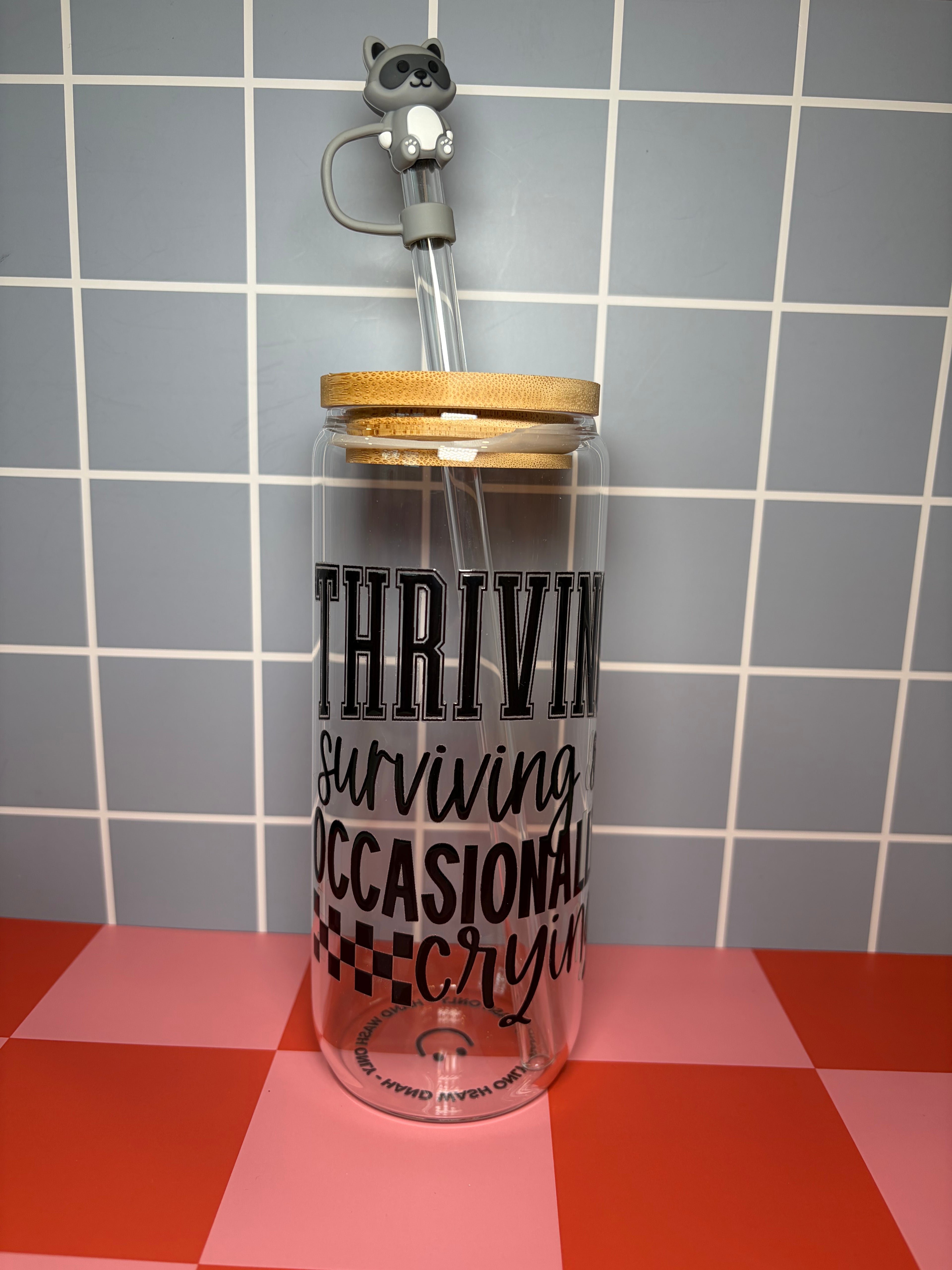 Thriving, surviving and ocasionally crying-themed glass can with straw topper