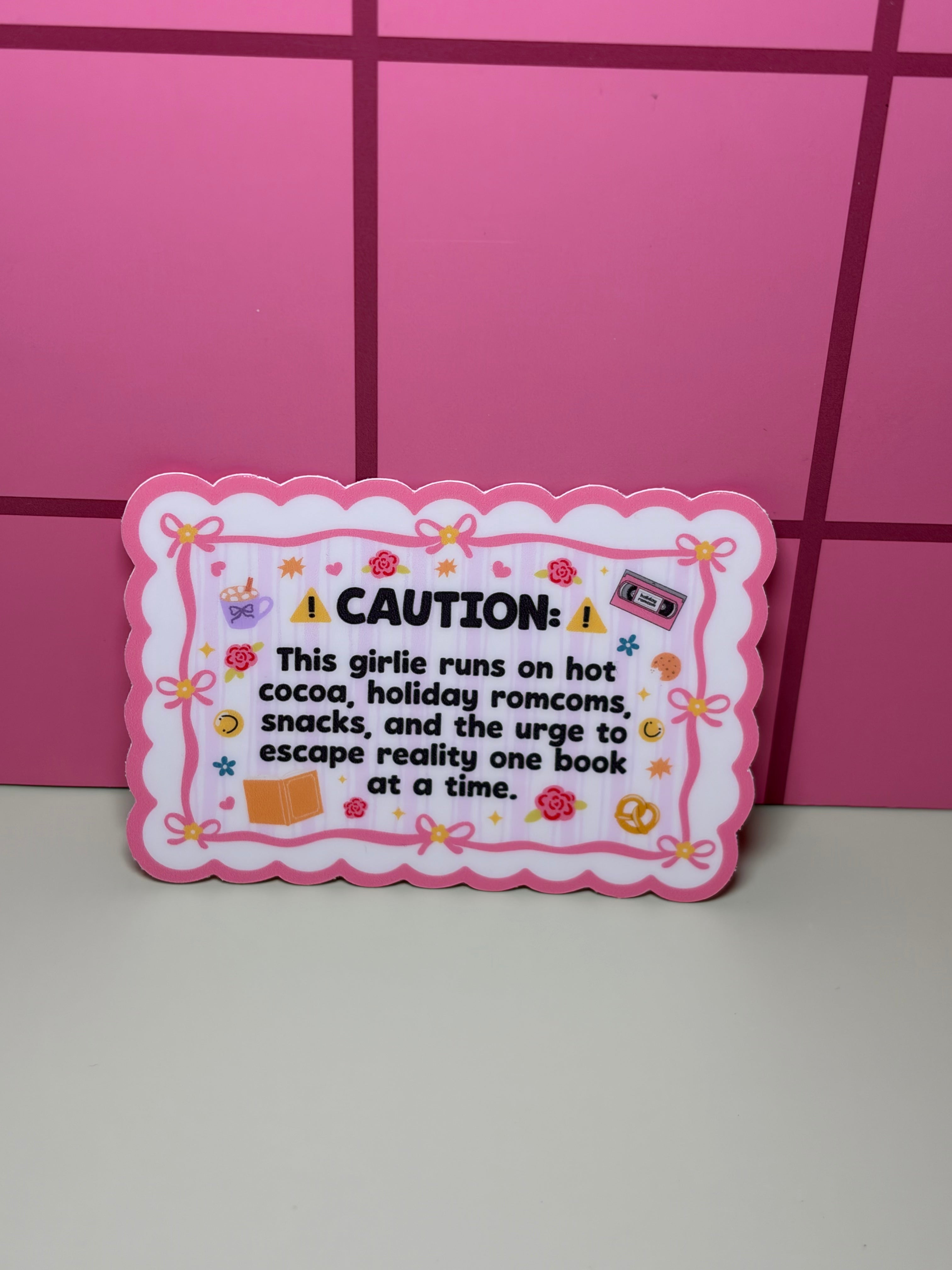 Caution: This girlie runs on hot coca, holiday rom coms, snacks, and the urge to escape reality one book at a time- Sticker