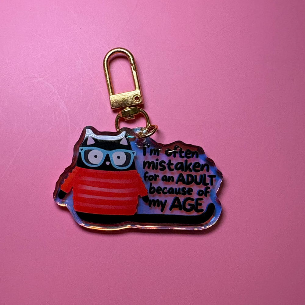 I'm often mistaken for an adult because of my age - Keychain