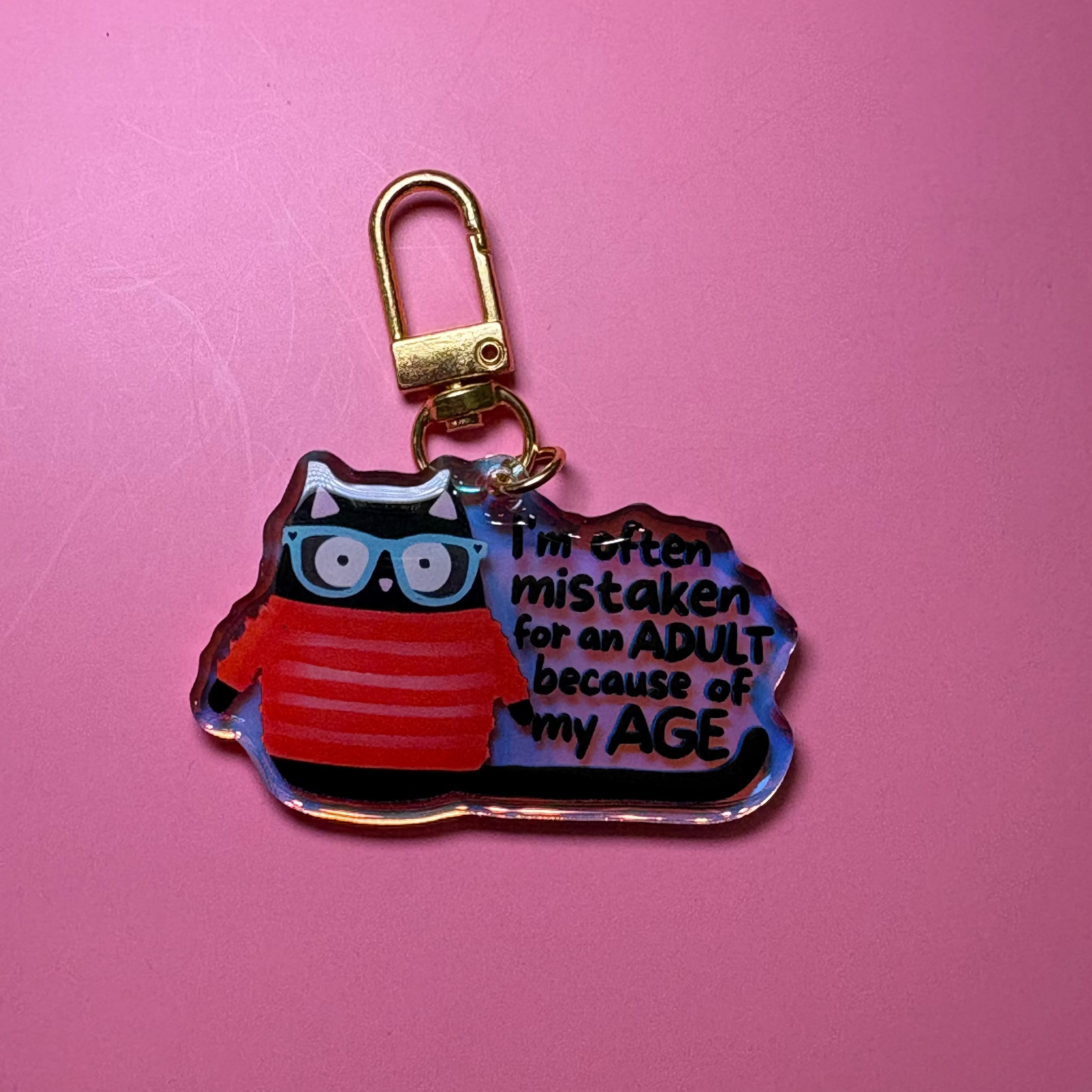 I'm often mistaken for an adult because of my age - Keychain